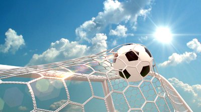 Soccer ball kicked into a goals net