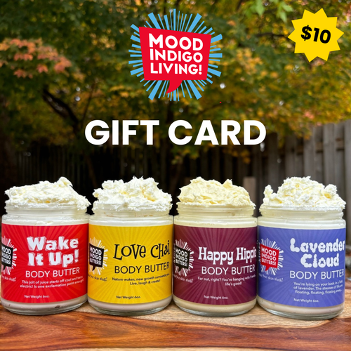 Four jars of Mood Indigo Living body butter with a gift card overlay on a wooden surface.