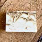Marbled , Lavender Matcha soap bar on a wooden surface