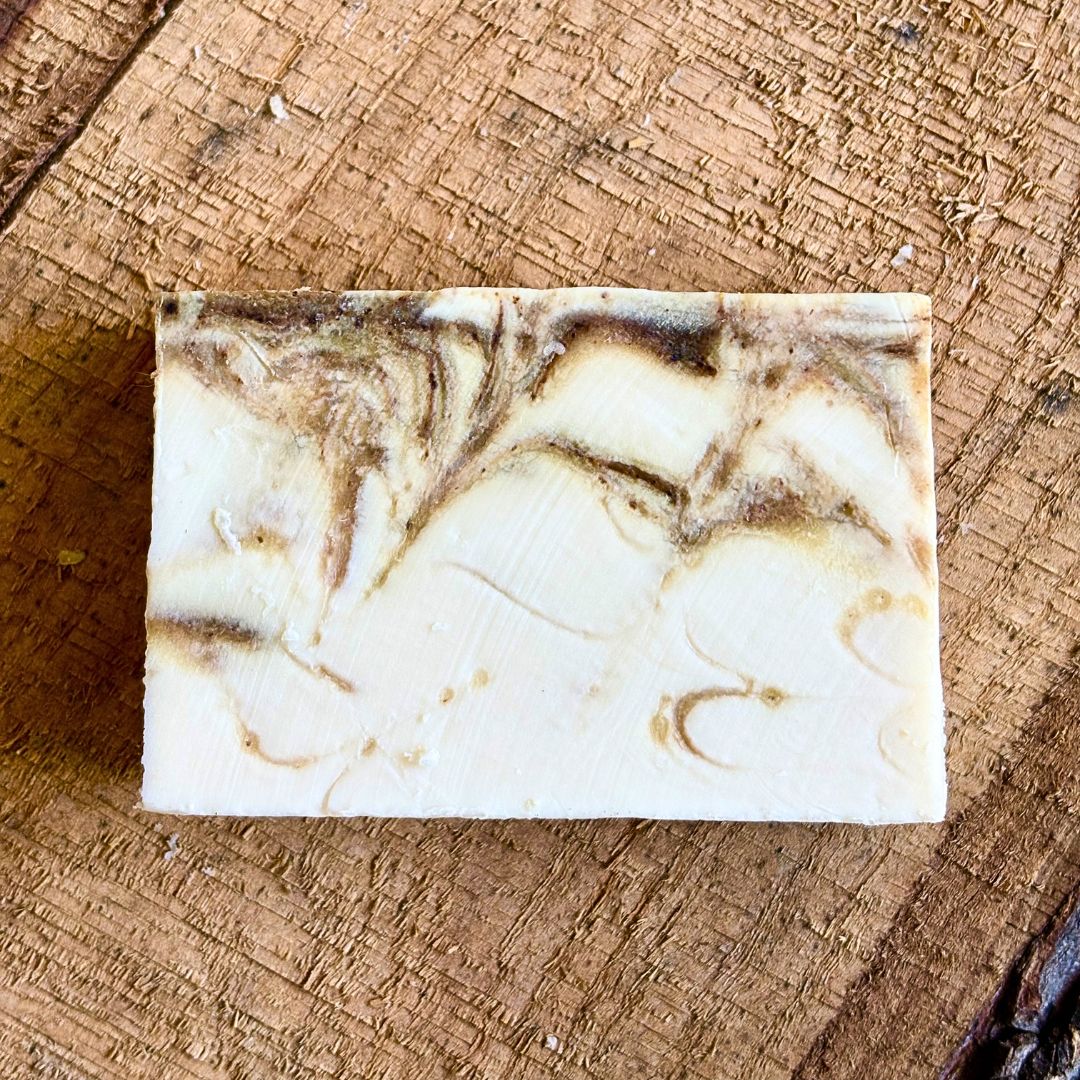 Marbled , Lavender Matcha soap bar on a wooden surface