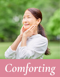 Woman with a comforting expression in a natural setting. Comforting collection by Mood indigo