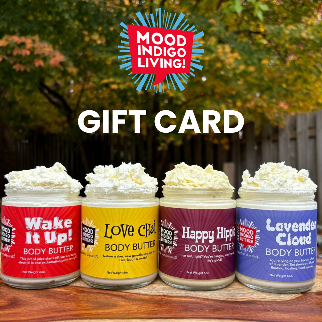 Four jars of Mood Indigo Living body butter with a gift card overlay on a wooden surface.