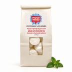 Mood Indigo Peppermint Loo Bombs 25-pack in a cream bag with a clear window and fresh mint on a white background.