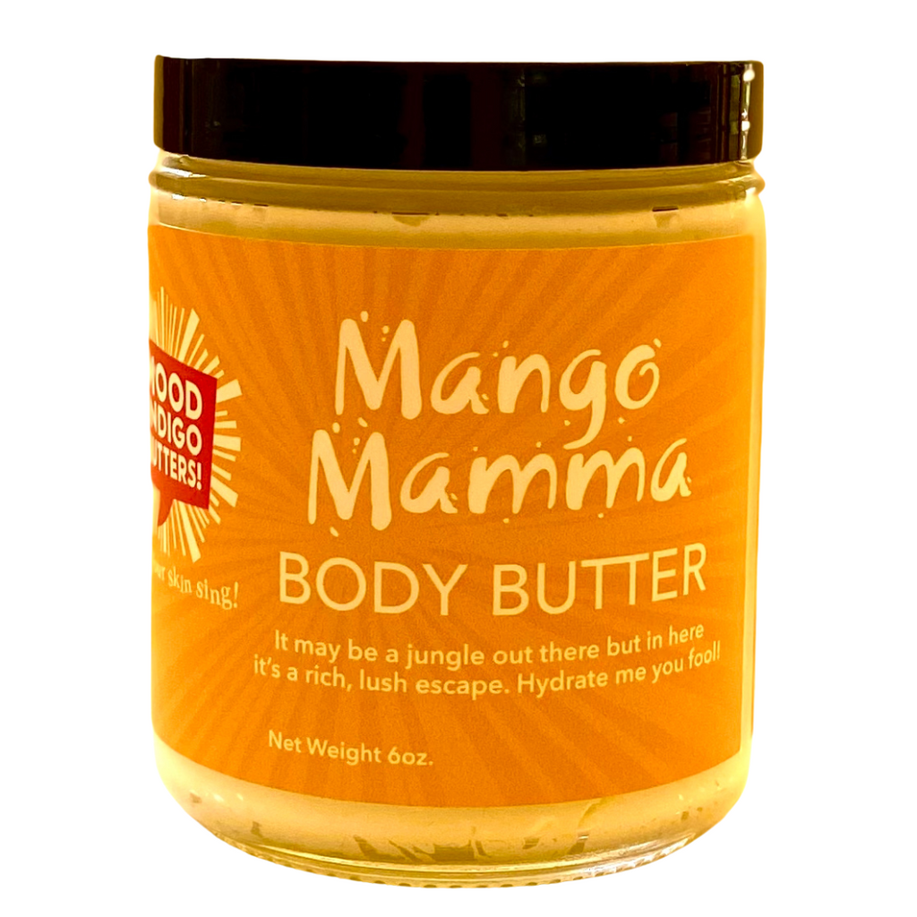 Hand-whipped Mango Body Butter in a clear jar showing creamy, soft-peaked texture."