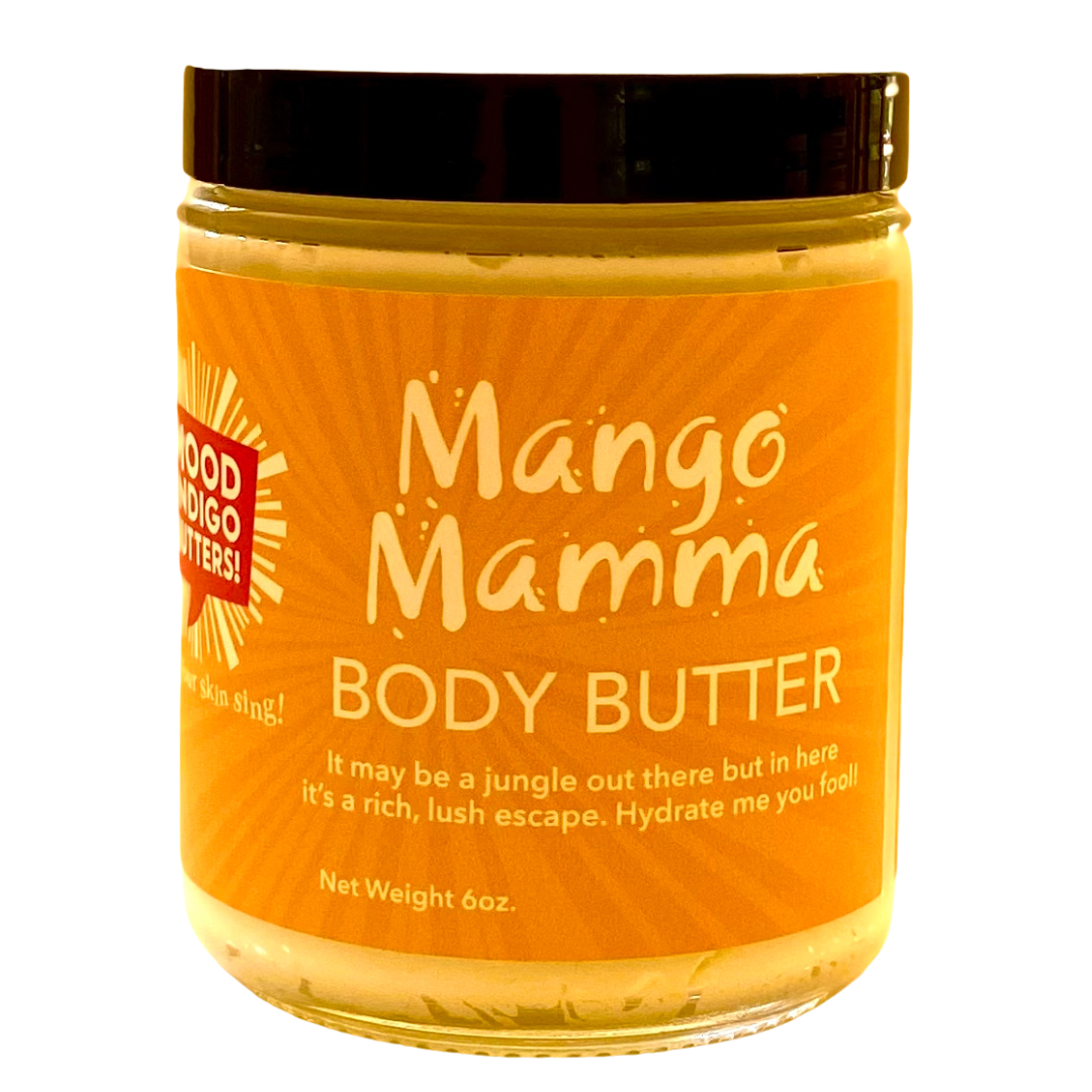 Hand-whipped Mango Body Butter in a clear jar showing creamy, soft-peaked texture."