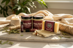 Patchouli Essentials Bundle 6-piece self-care set arranged on natural wood surface with dried patchouli leaves, candles, and soft textiles in a spa-inspired bohemian luxury setting