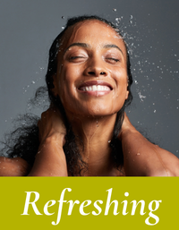 Happy, refreshed woman showering with water droplets and 'Refreshing' text. Refreshing collection by Mood indigo