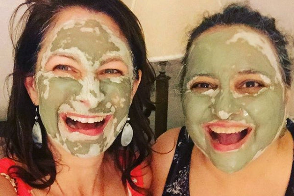 Rea and friend with green mask on their faces