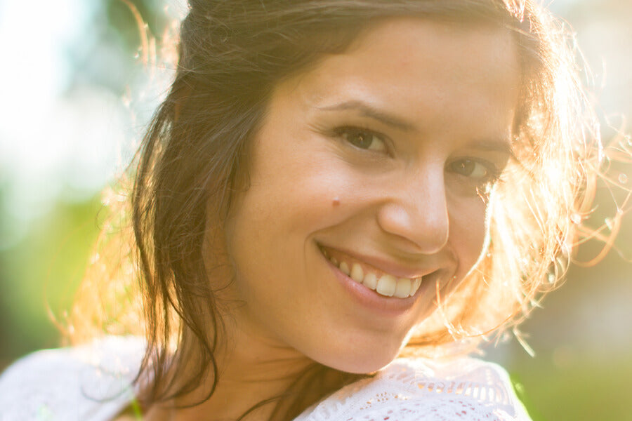 woman smiling in the sun