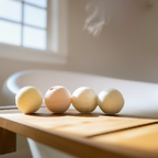 Natural, soothing bath bombs by Mood Indigo on a wood plank near a tub
