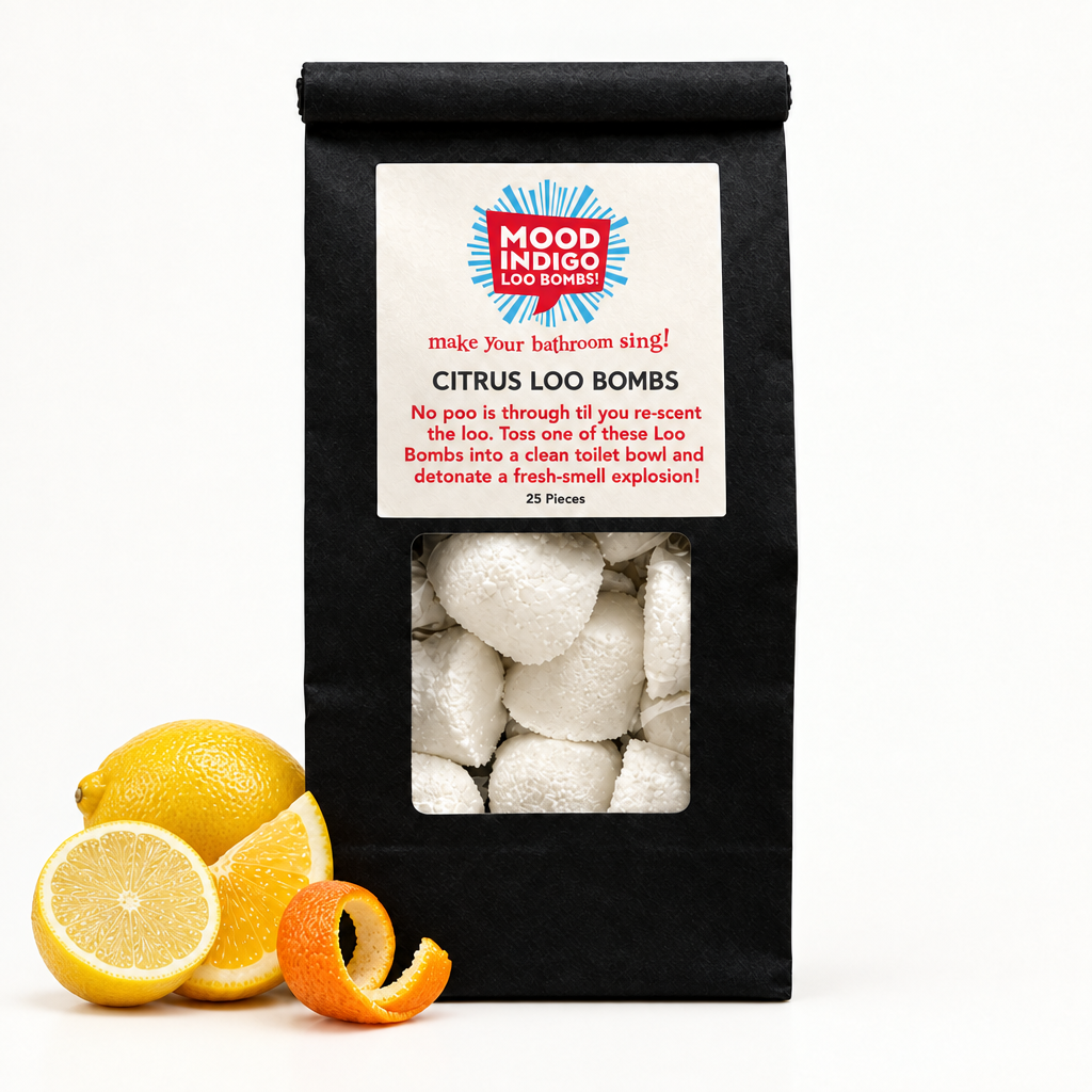Mood Indigo Citrus Loo Bombs 25-pack in a black bag beside whole and cut lemons and orange peel on a white background.