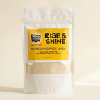 Mood Indigo Rise & Shine face mask in a white 6 oz pouch with a yellow label and a clear window showing the clay powder.