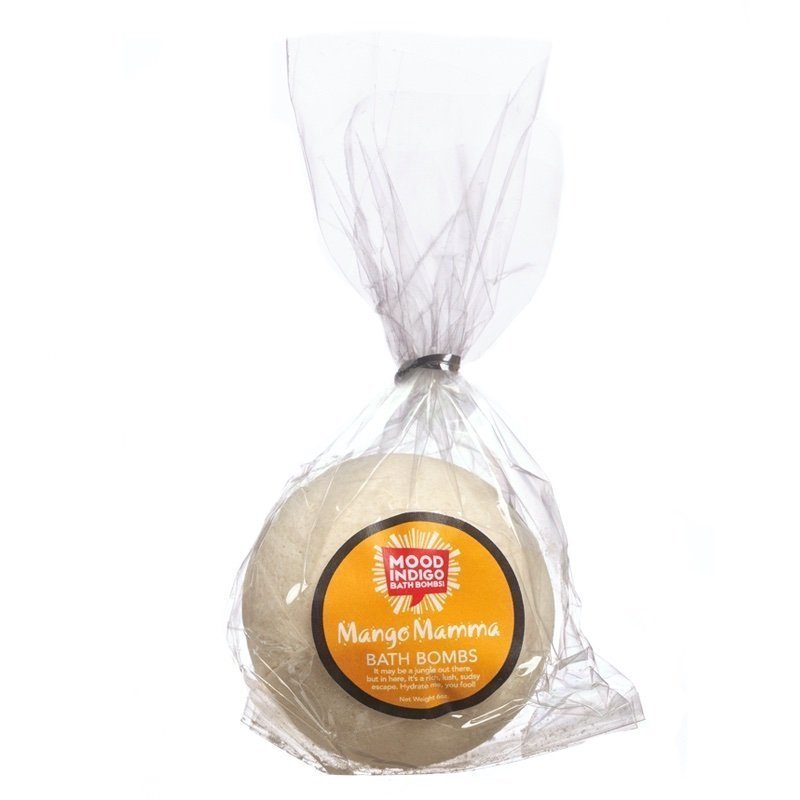 A bath bomb named Mango Mamma from Mood Indigo Living, packaged in a clear compostable wrapper with a red and yellow label, indicating it is a product for lush tropical scents and baths.